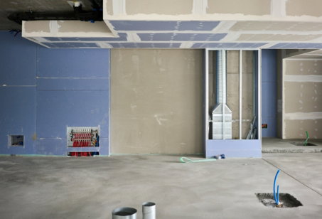 A room that has some paint on the floor